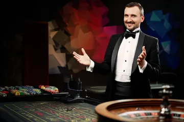 A glowing roulette wheel with cascading chips, symbolizing the engaging live and instant-win games available on JUGABETT.