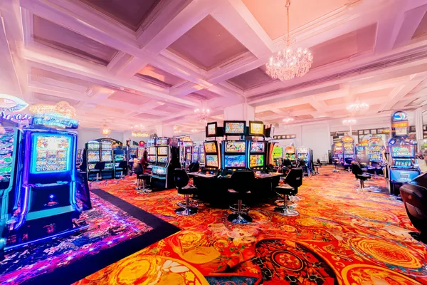 A laptop glowing with a bright login prompt in a minimalistic setup, symbolizing the protected access system at JUGABETT.